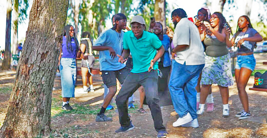 Students celebrate at the annual barbecue, sponsored by Black clubs and organizations, at Lake Yosemite.